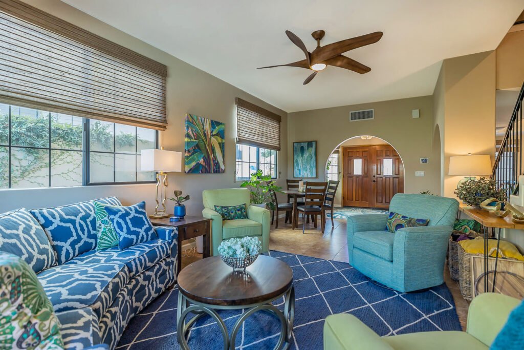 Colorful living room with view to arched entry