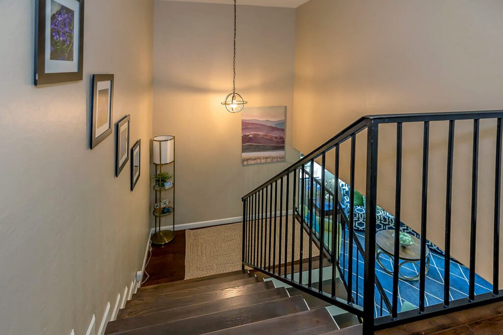 Stairwell with decor using lights and textiles.