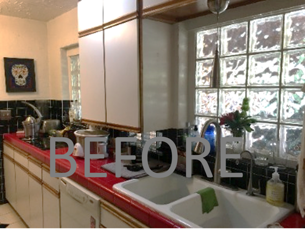Outdated Red and white kitchen with glass block with no storage space and outdated.