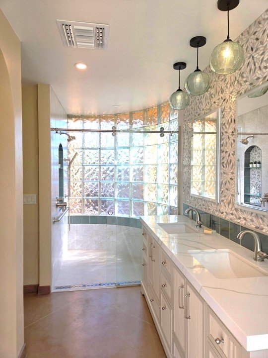 Bathroom Remodel AFTER Leaf pattern tile and lighting curved glass block shower wall